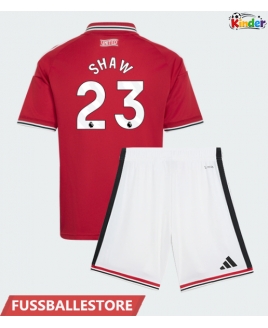 Günstige Manchester United Luke Shaw #23 Heimtrikotsatz Kinder 2026-27 Kurzarm (+ Kurze Hosen)